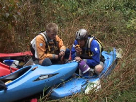 Calling in the porters after portaging Tal gorge